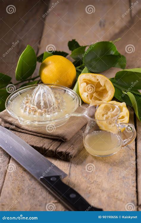 Glass Bowl Of Freshly Squeezed Lemon Juice Lemon Squeezer And R Stock Photo Image Of Juice