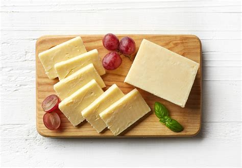 Piece And Slices Of White Cheddar Cheese Bongards